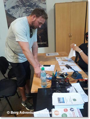 Chad Brennand having his climbing permit issued.