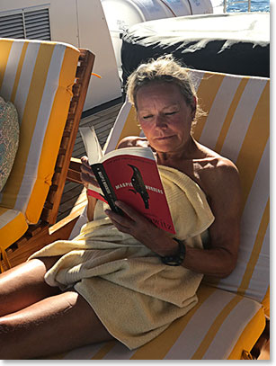 Elaine catching up on some reading on board the Petrel