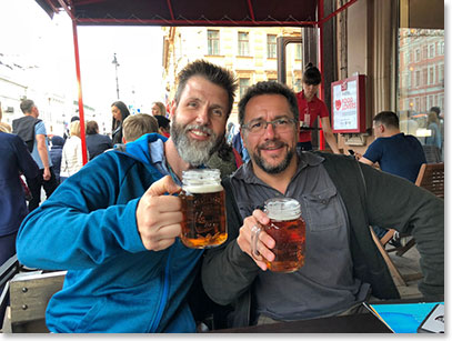 Shannon and Joe enjoy a beer on the street in St. Petersburg; tonight we will board the midnight train to Moscow