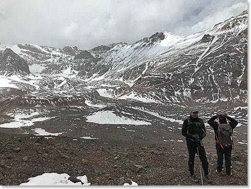 Looking down on base camp during acclimatization hike. Tomorrow’s objective is Plaza Canada at 16,500 ft. It’s behind the notched rock directly above John’s head.