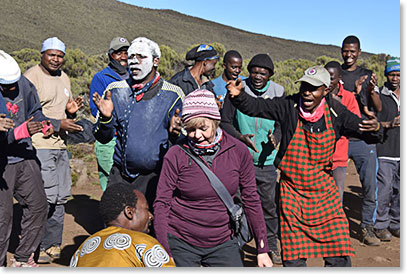 Tracey being welcomed by our staff at Shira Camp