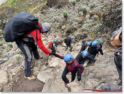 BAI guide giving Tracey a hand