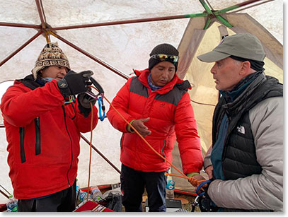 Berg Adventures guides adjusting Frank Giustra climbing gear